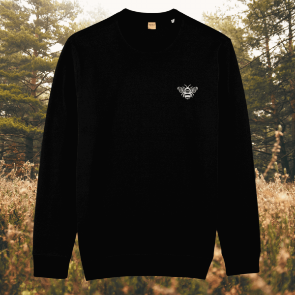 Black organic cotton sweater featuring a bee design with the quote “Believe in Yourself” – MindfulEarth, front view.