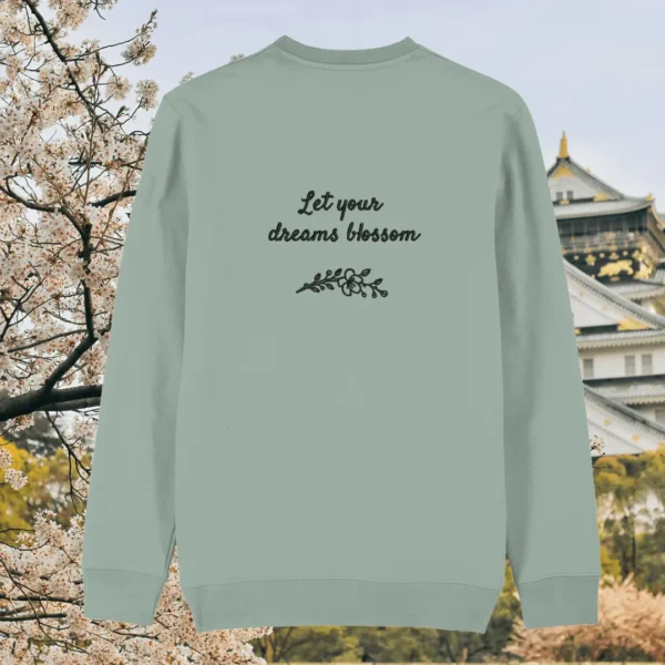 Back of the aloe green organic cotton sweater with the words “Let Your Dreams Blossom” in floral style – Mindful Earth UK sustainable fashion