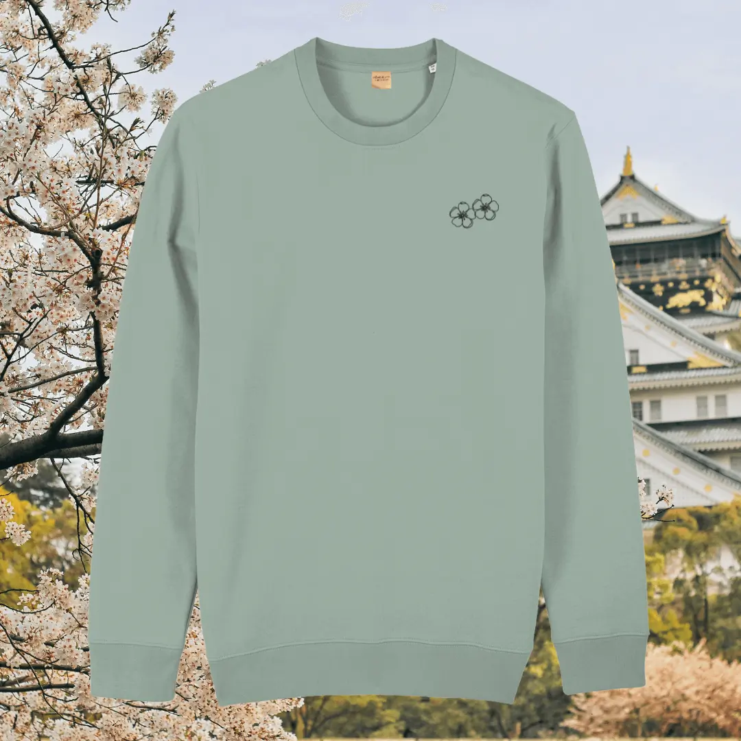 Aloe green organic cotton sweater with blossom floral artwork on the front – Mindful Earth sustainable UK clothing