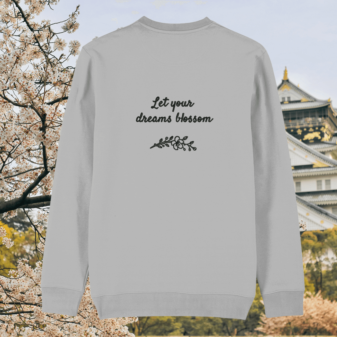 Back of the Heather Grey organic cotton sweater featuring the quote “Let Your Dreams Blossom” in floral style – Mindful Earth UK sustainable fashion