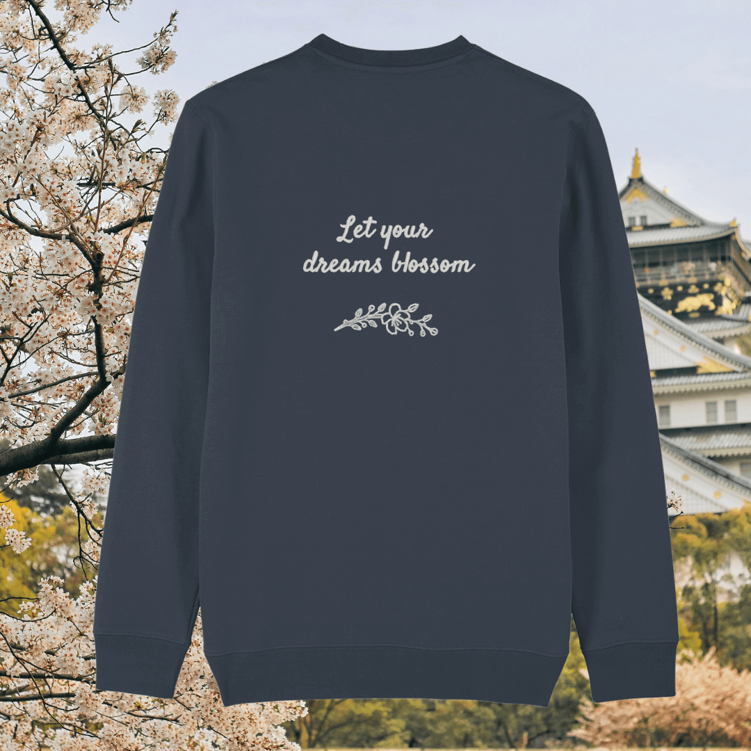 Back of the India Ink Grey organic cotton sweater featuring the quote “Let Your Dreams Blossom” in floral style – Mindful Earth UK sustainable fashion