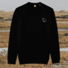 Front view of the Capybara Black organic cotton sweater featuring the “Spread Peace and Kindness” design by Mindful Earth.