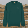 Front view of the Capybara Glazed Green organic cotton sweater featuring the “Spread Peace and Kindness” design by Mindful Earth.