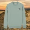 Front view of the Highland Cow Aloe organic cotton sweater featuring the “Live Like Someone Left the Gate Open” design by Mindful Earth.