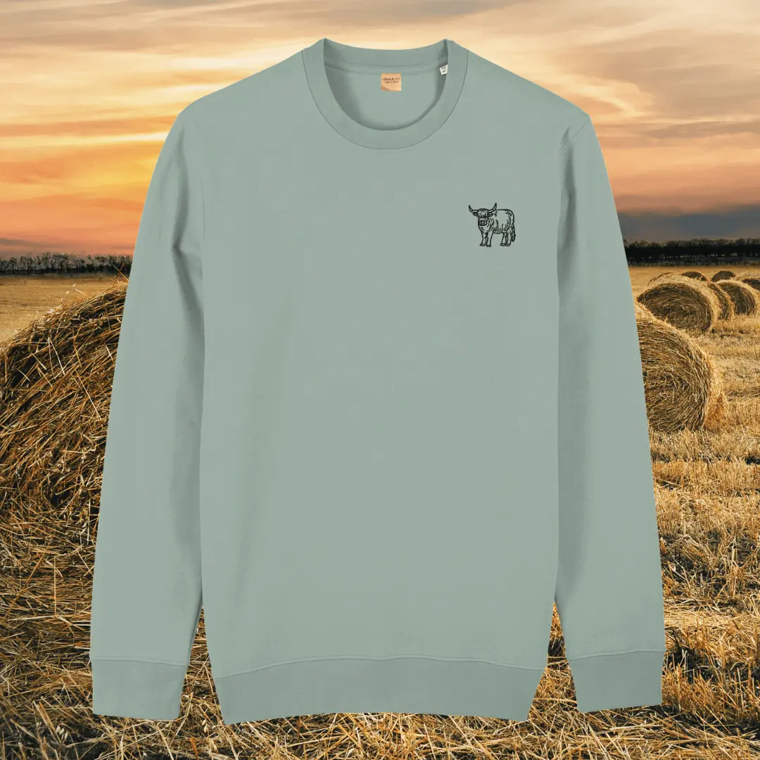 Front view of the Highland Cow Aloe organic cotton sweater featuring the “Live Like Someone Left the Gate Open” design by Mindful Earth.