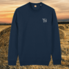 Front view of the Highland Cow French Navy organic cotton sweater featuring the “Live Like Someone Left the Gate Open” design by Mindful Earth.
