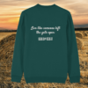 Back view of the Highland Cow Glazed Green organic cotton sweater with a minimalist plain back by Mindful Earth.