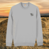 Front view of the Highland Cow Heather Grey organic cotton sweater featuring the “Live Like Someone Left the Gate Open” design by Mindful Earth.