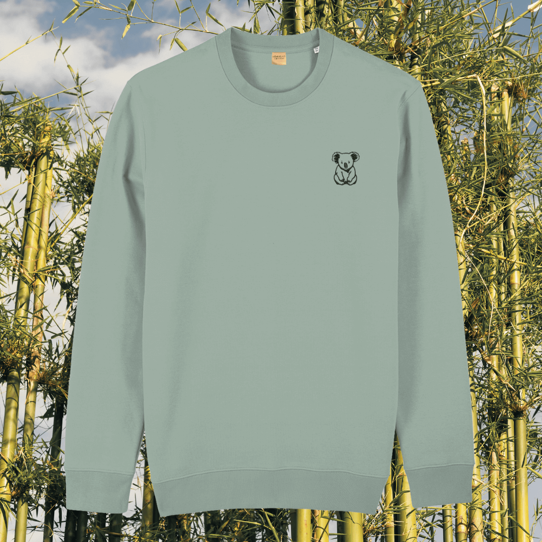 Front view of the Koala Aloe organic cotton sweater featuring the “Create Your Happy Place” design by Mindful Earth.