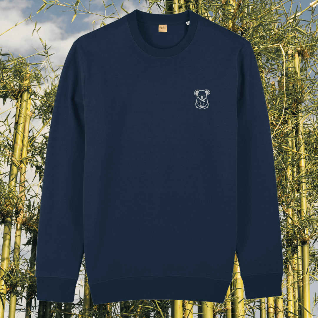 Front view of the Koala French Navy organic cotton sweater featuring the “Create Your Happy Place” design by Mindful Earth.