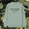 Back view of the Monstera Aloe organic cotton sweater with the “Life’s a Climb but the View is Great” print by Mindful Earth.