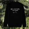 Back view of the Monstera Black organic cotton sweater with the “Life’s a Climb but the View is Great” print by Mindful Earth.