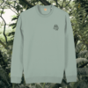 Aloe green organic cotton sweater with sloth design and motivational “Just Hang In There” message on the front – Mindful Earth sustainable UK clothing