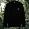 Black organic cotton sweater with sloth design and motivational “Just Hang In There” message on the front – Mindful Earth sustainable UK clothing