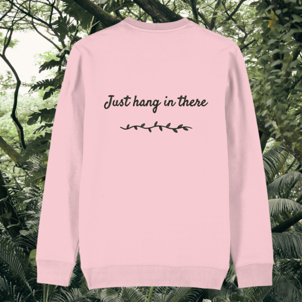 Back of the Cotton Pink organic cotton sweater featuring sloth illustration and the phrase “Just Hang In There” – Mindful Earth UK sustainable fashion