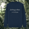 Back of the French Navy organic cotton sweater featuring sloth illustration and the phrase “Just Hang In There” – Mindful Earth UK sustainable fashion