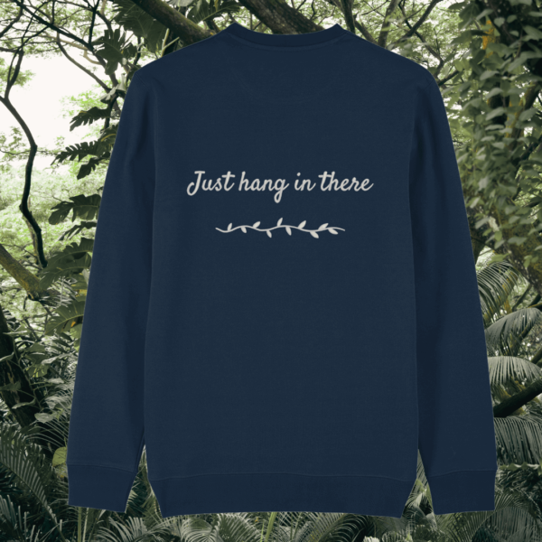 Back of the French Navy organic cotton sweater featuring sloth illustration and the phrase “Just Hang In There” – Mindful Earth UK sustainable fashion