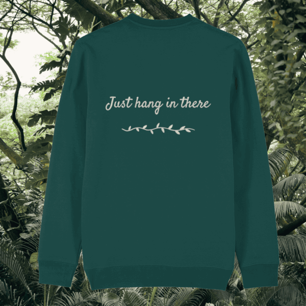 Back of the Glazed Green organic cotton sweater featuring sloth illustration and the phrase “Just Hang In There” – Mindful Earth UK sustainable fashion