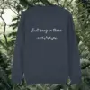 Back of the India Ink Grey organic cotton sweater featuring sloth illustration and the phrase “Just Hang In There” – Mindful Earth UK sustainable fashion