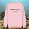 Back of the Cotton Pink organic cotton sweater featuring turtle illustration and the phrase “Embrace the Journey” – Mindful Earth UK sustainable fashion