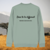 Back of the aloe green organic cotton sweater with zebra print detail and “Dare to Be Different” inspirational design – Mindful Earth UK sustainable fashion
